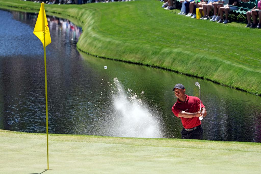 Tiger Woods plays a shot from a bunker on the 16th hole during the final round of the 2024 Masters.