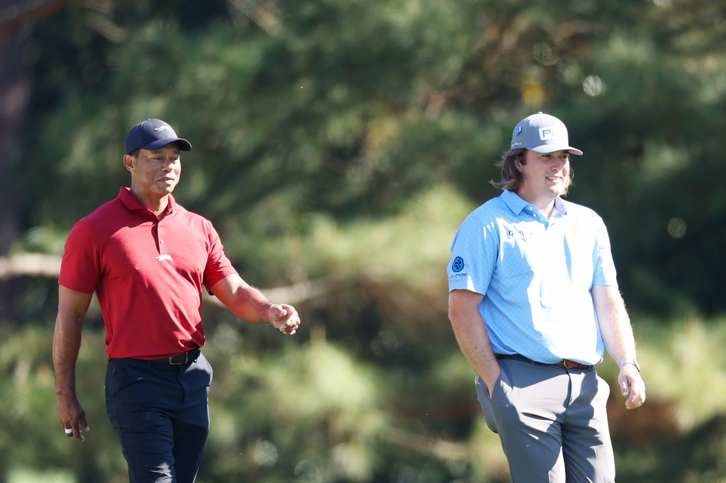 Tiger Woods and amateur golfer Neal Shipley walking across the second hole during the final round of the 2024 Masters Tournament at Augusta National Golf Club, Georgia