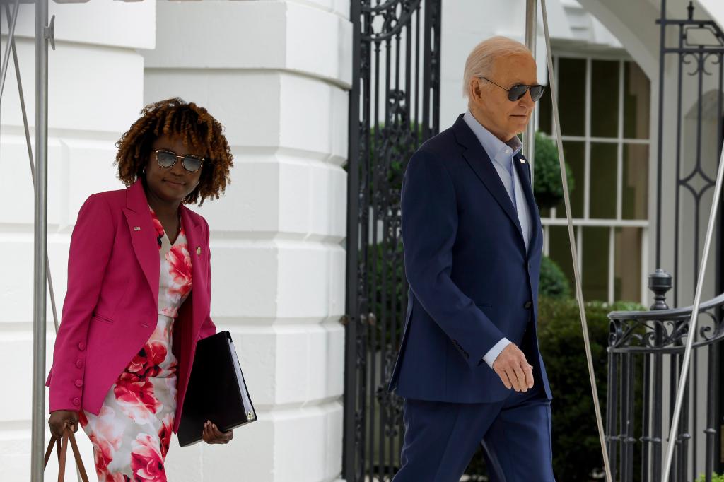 President Joe Biden walks to board Marine One with White House Press Secretary Karine Jean-Pierre on the South Lawn of the White House on April 18, 2024 in Washington, DC.