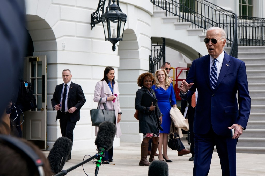 President Joe Biden walks over to members of the media as staff and aides leave the White House before walking towards Marine One as he departs Washington, U.S., April 25, 2024