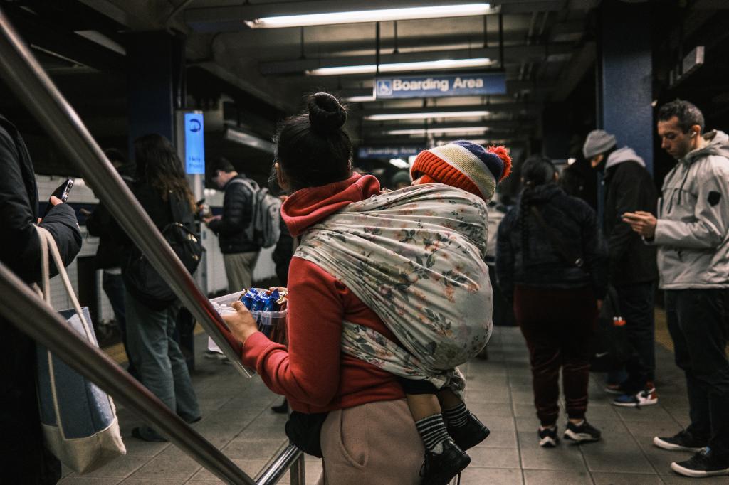 Migrant mom and child in the subways.