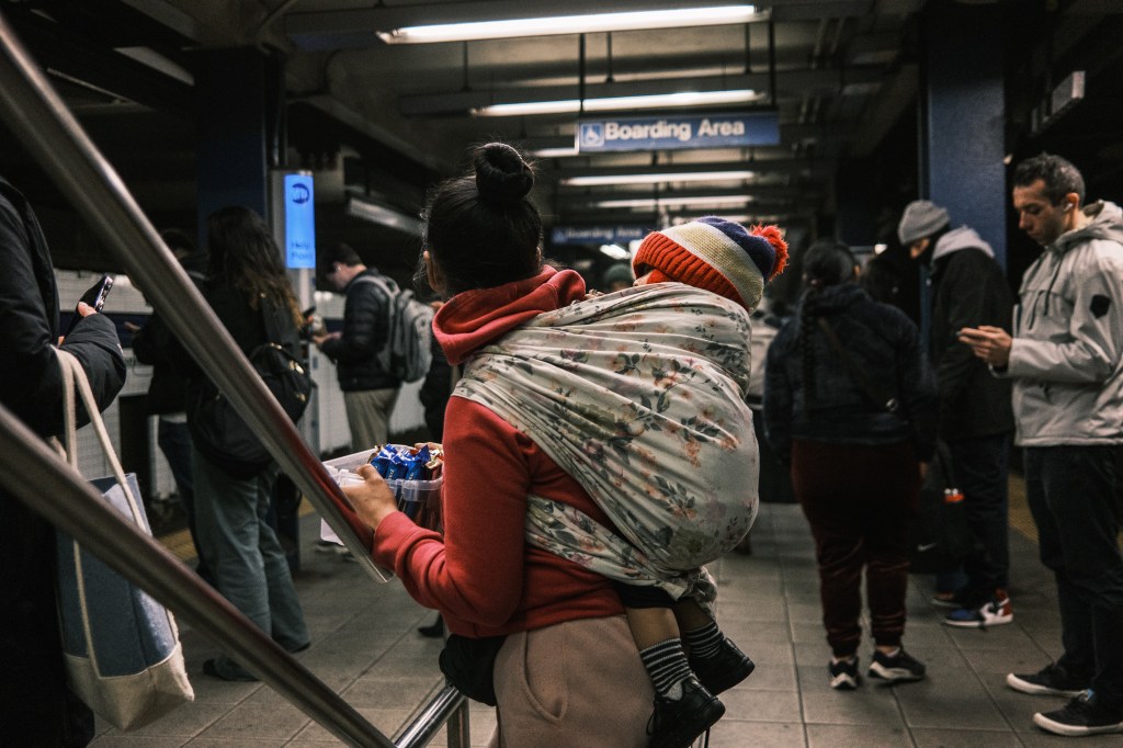 Migrant mom and child in the subways.