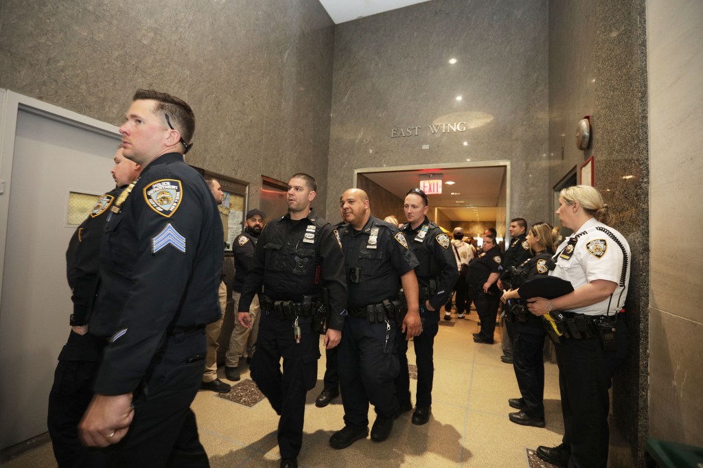 The arraignment was attending by a large group of NYPD officers. 