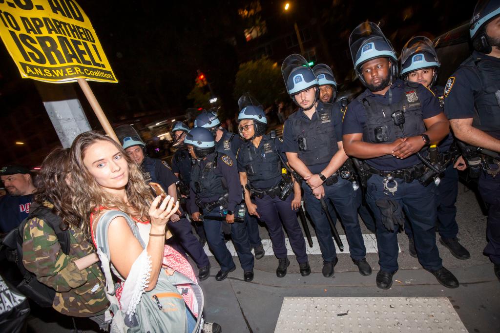 Before police moved in, hundreds of protesters played games like Connect 4 and Jenga drew on the ground with chalk, and munched on cookies.