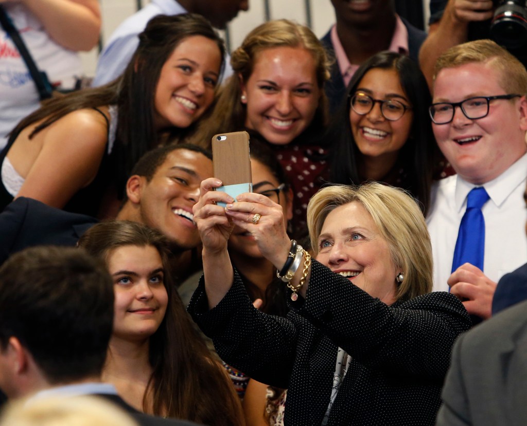 Hillary Clinton taking a selfie with supporters