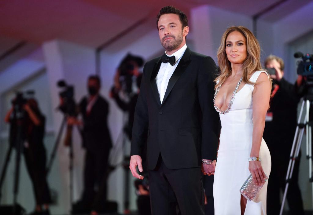 Ben Affleck and Jennifer Lopez dressed well and standing together.