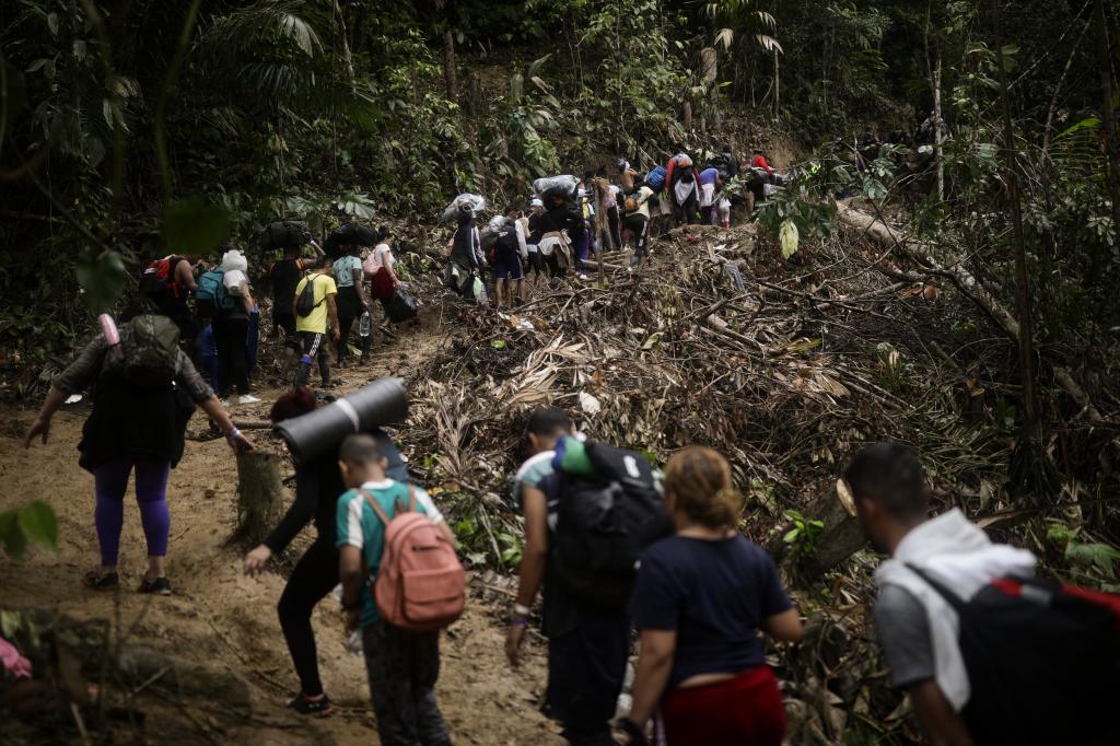 Migrants walking across the Darien Gap from Colombia to Panama on May 9, 2023.