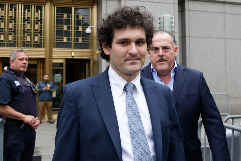 Sam Bankman-Fried in suit and tie leaving the Moynihan United States Courthouse in New York on June 15, 2023, facing financial fraud charges