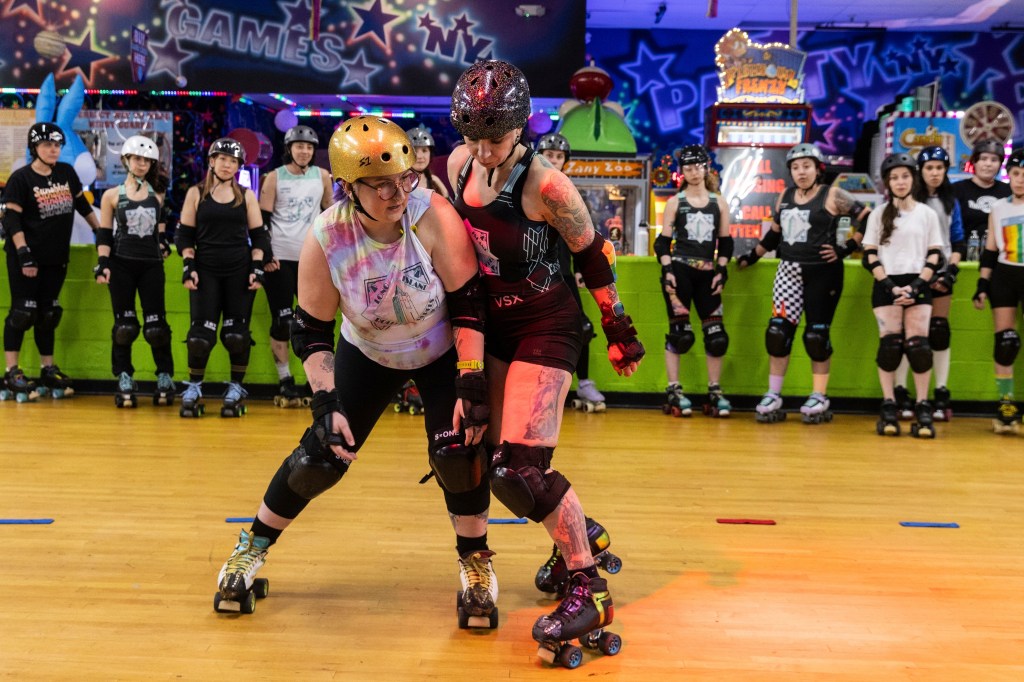 Caitlin Carroll demonstrating roller derby skills at United Skates of America in Seaford, N.Y., 2023