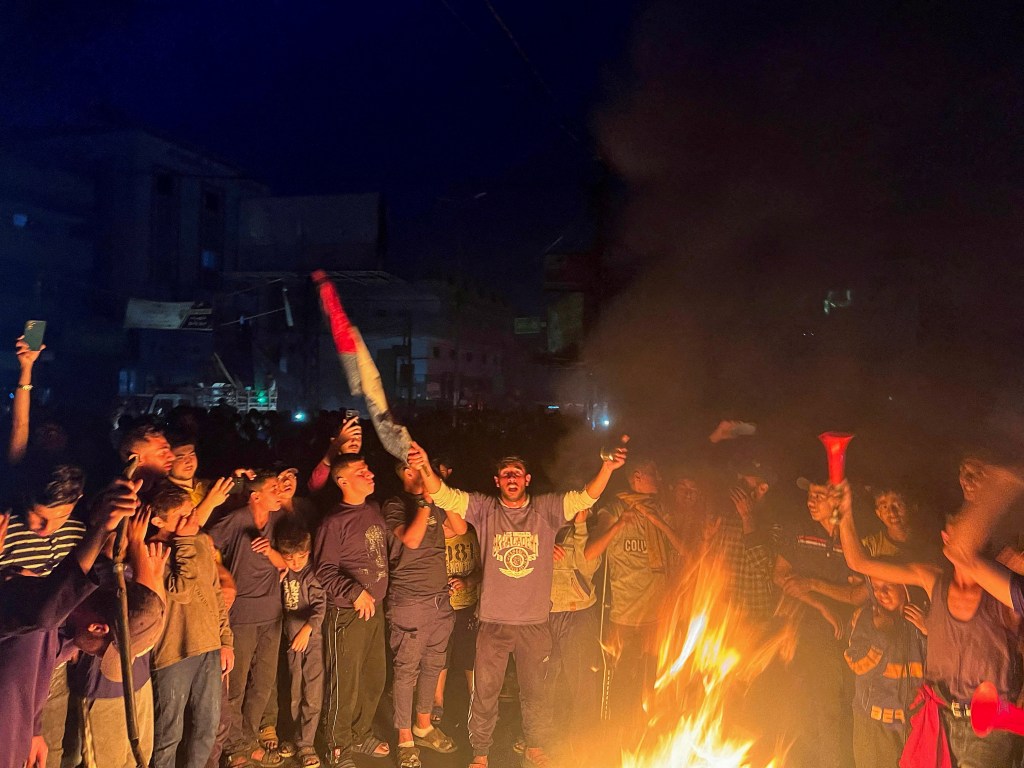 Palestinians react after Hamas accepted a ceasefire proposal from Egypt and Qatar, in Rafah, in the southern Gaza Strip, May 6, 2024. 