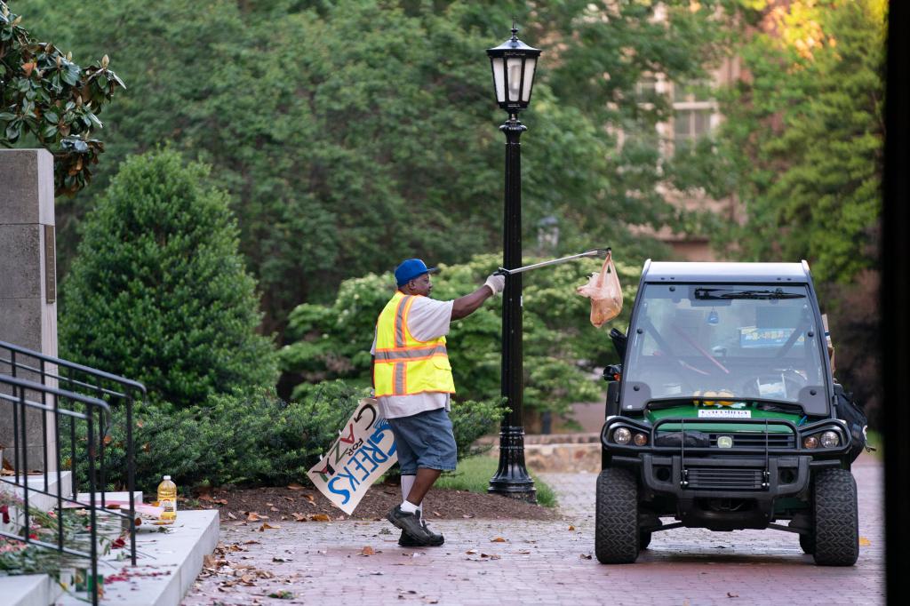 A worker cleans up at Polk Place at the University of North Carolina on May 1, 2024 in Chapel Hill, North Carolina.