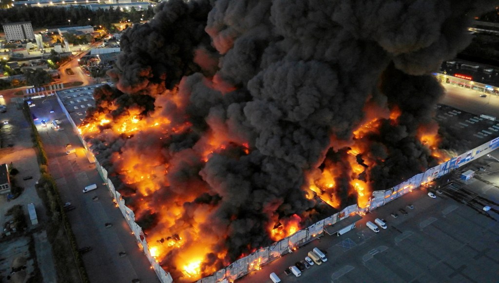 Drone view of the Marywilska 44 shopping centre burning during a massive fire in Warsaw, Poland