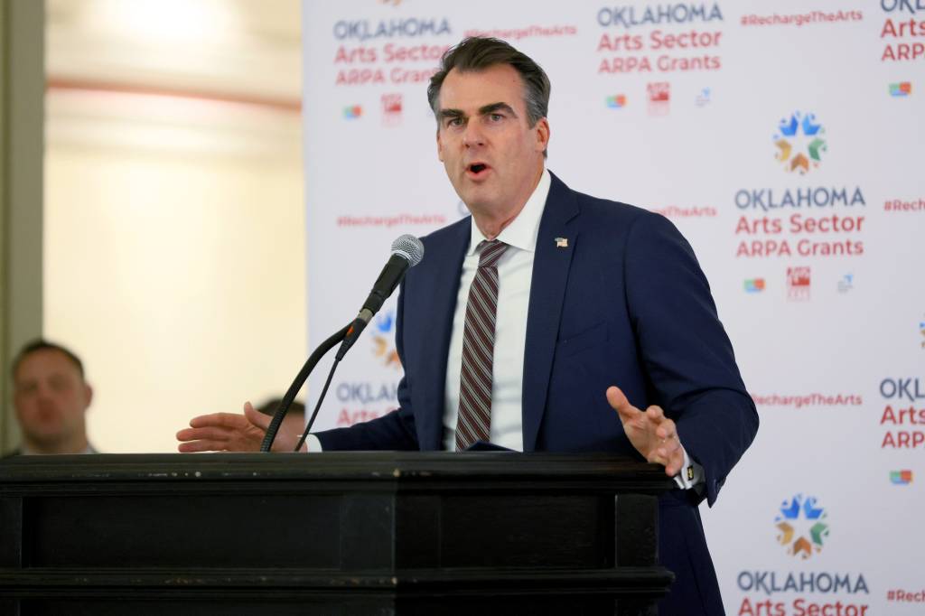 Gov. Kevin Stitt speaks at the state Capitol in Oklahoma City. 