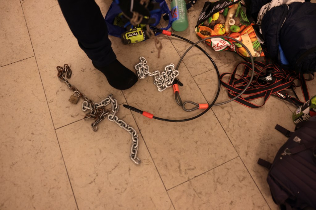 Chain and tools are left on the ground as demonstrators from the pro-Palestine encampment barricade themselves inside Hamilton Hall.