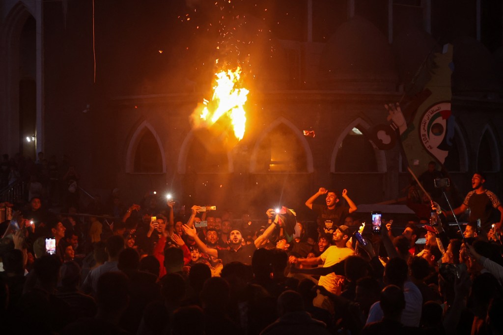 Palestinians celebrate in a street in Rafah, in the southern Gaza Strip, after Hamas announced it has accepted a truce proposal on May 6, 2024