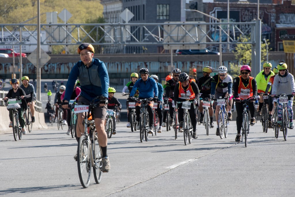 Bikers crossing Third Ave