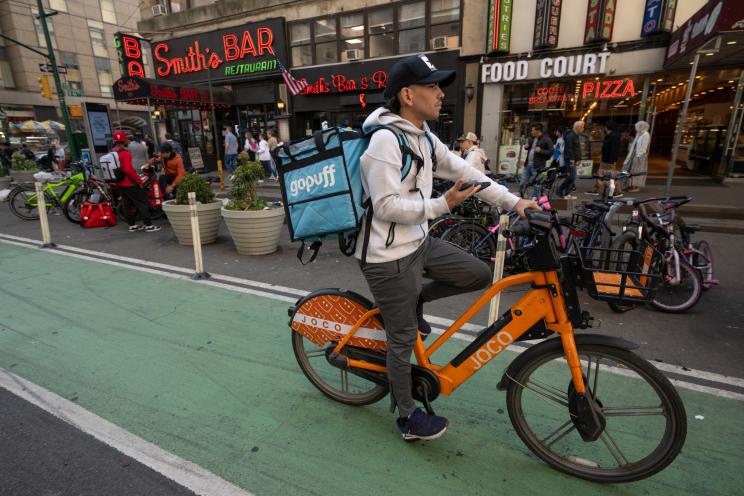 Food delivery driver on a bike. 