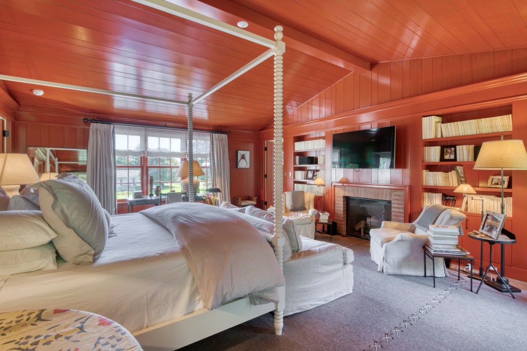 One of the bedrooms, with a fireplace, in the converted barn