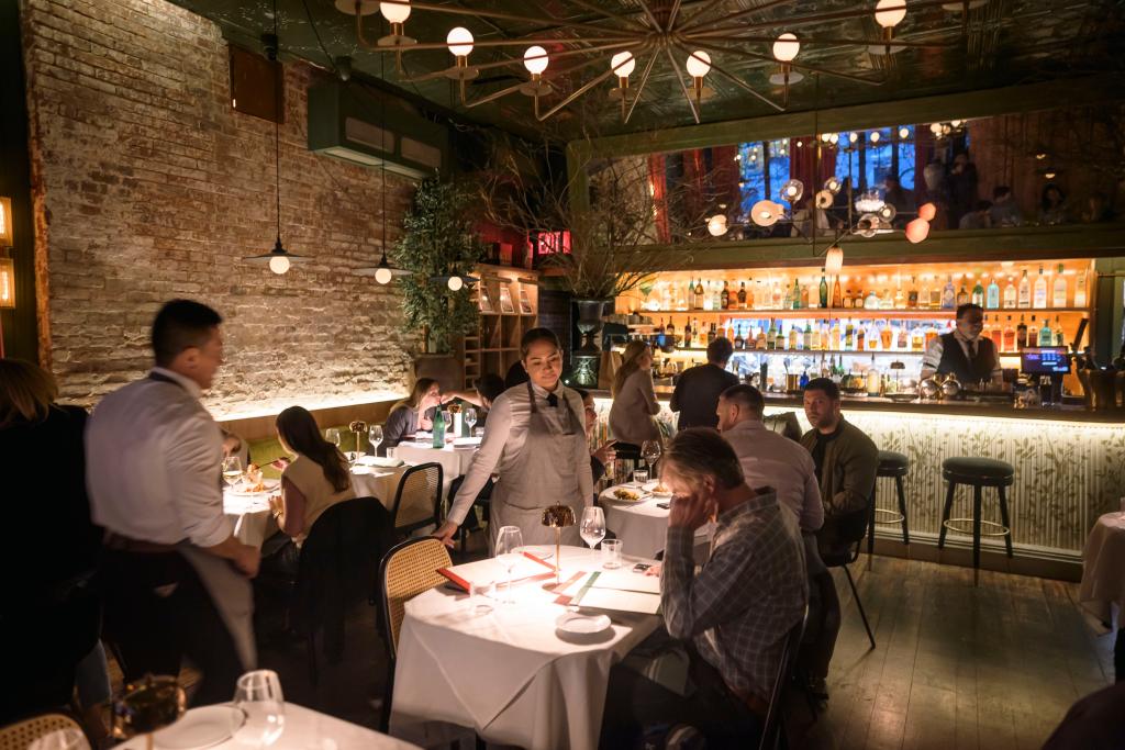 Group of people dining in the ground floor of Tucci NYC, a fine Italian restaurant in NoHO, Manhattan NY