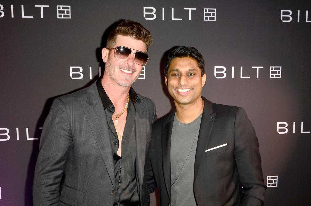 Robin Thicke and Bilt Rewards CEO Ankur Jain posing at Bilt Rewards Casino Royale Party in San Diego, California