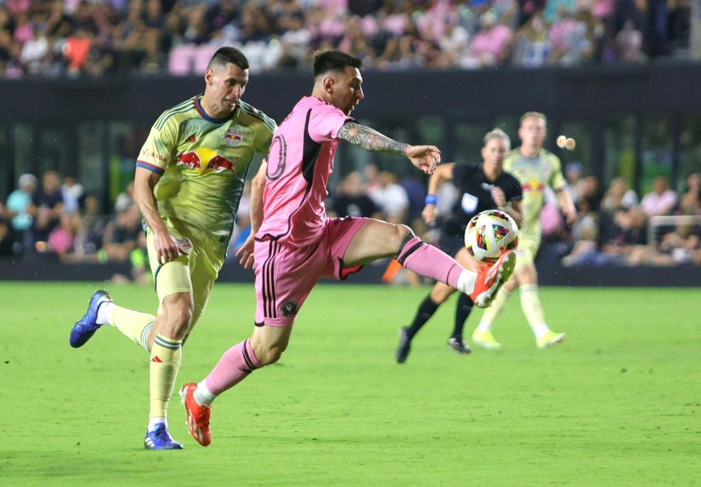 Lionel Messi fights for the ball as Sean Nealis defends during the Red Bulls' 6-2 loss.