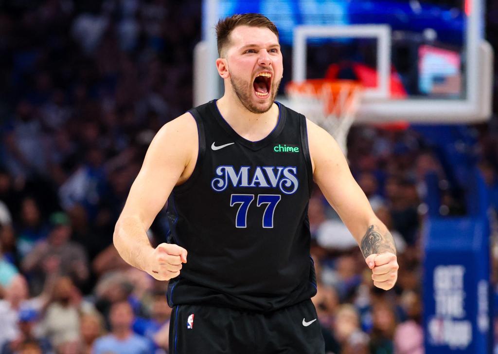 Luka Doncic, who had a triple double, celebrates during the second half of the Mavericks' series-clinching win.