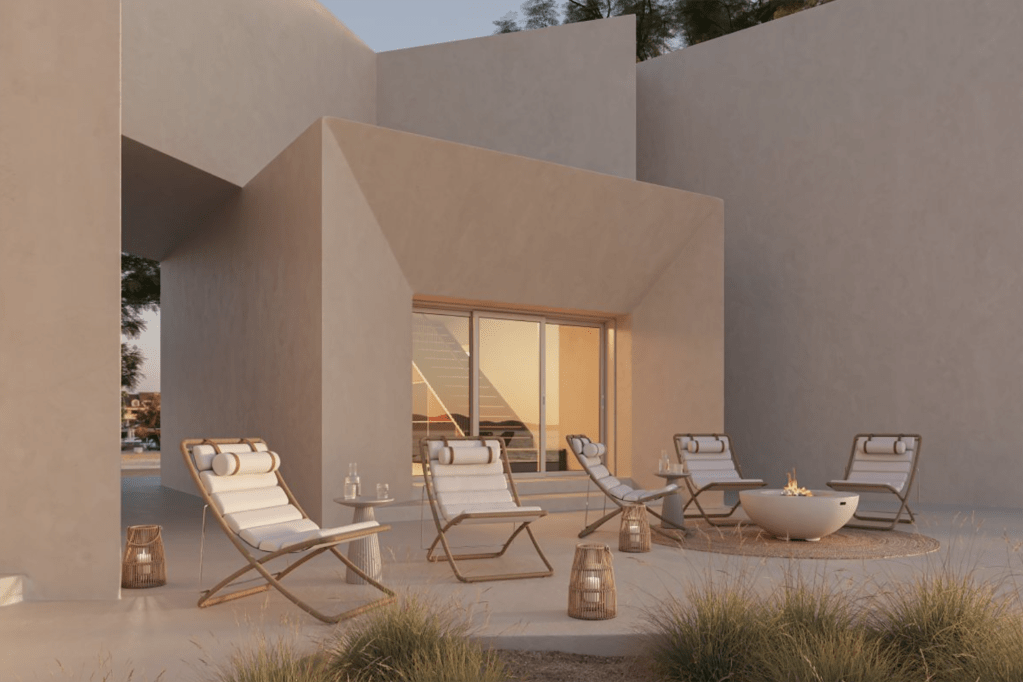 A patio with chairs and a fire pit