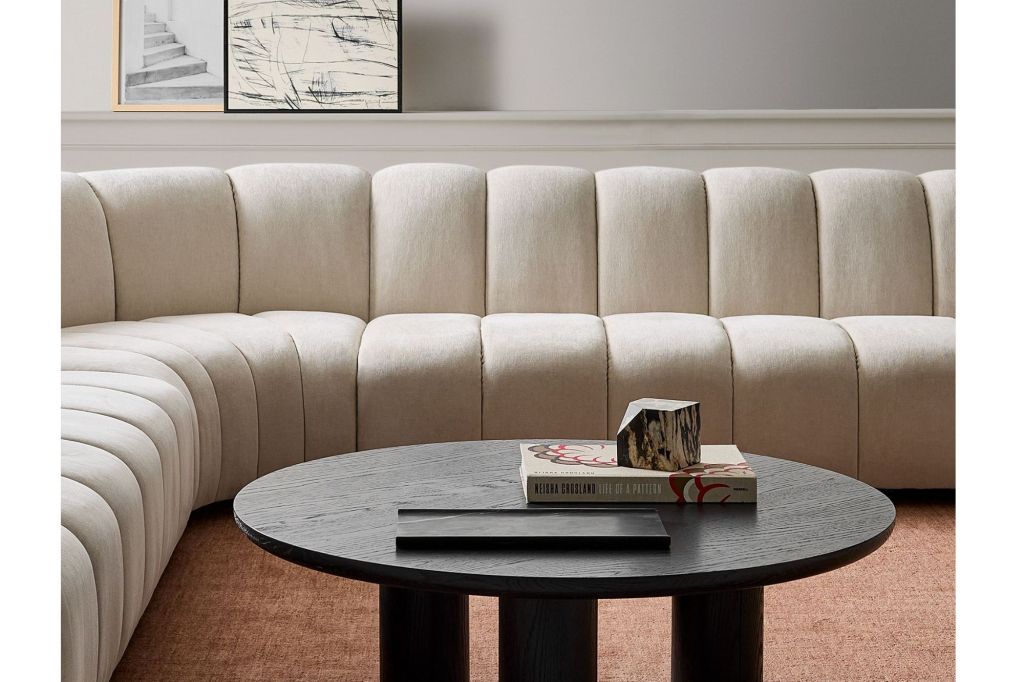 A cloud-like couch and modern wooden table