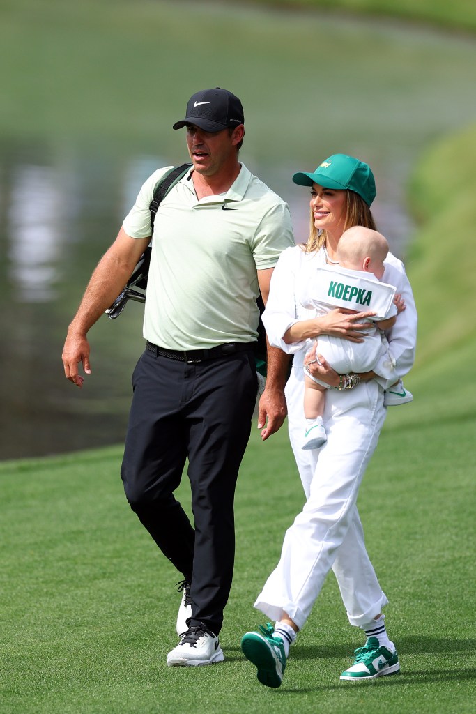 Brooks Koepka and wife Jena Sims with son Crew at the Masters in April 2024.