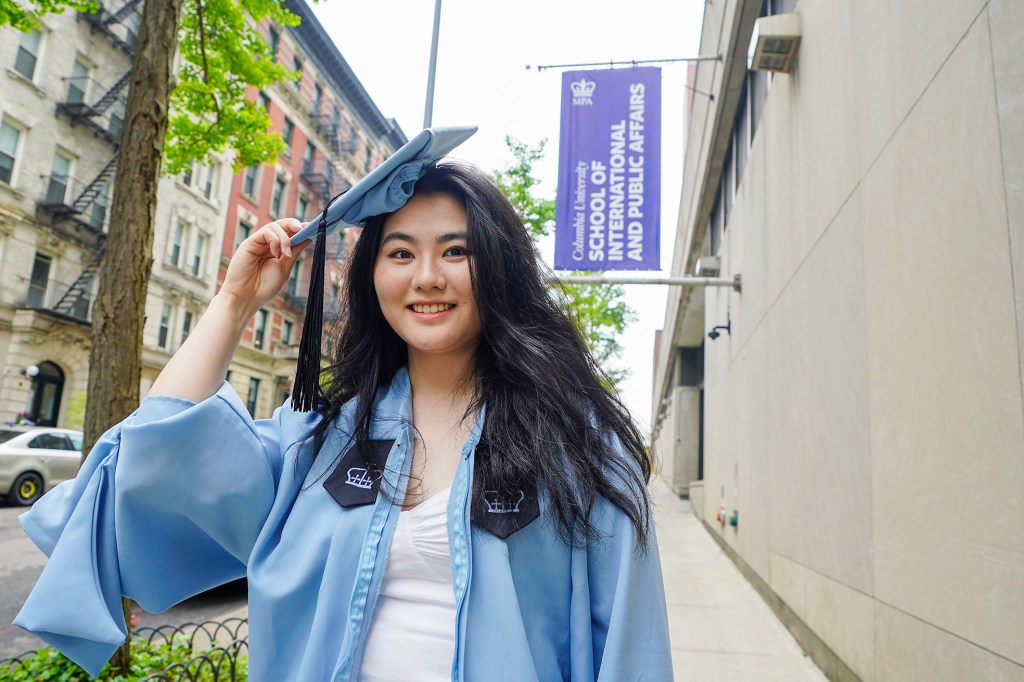 Columbia student Dongzi Peng on campus to take graduation photos.