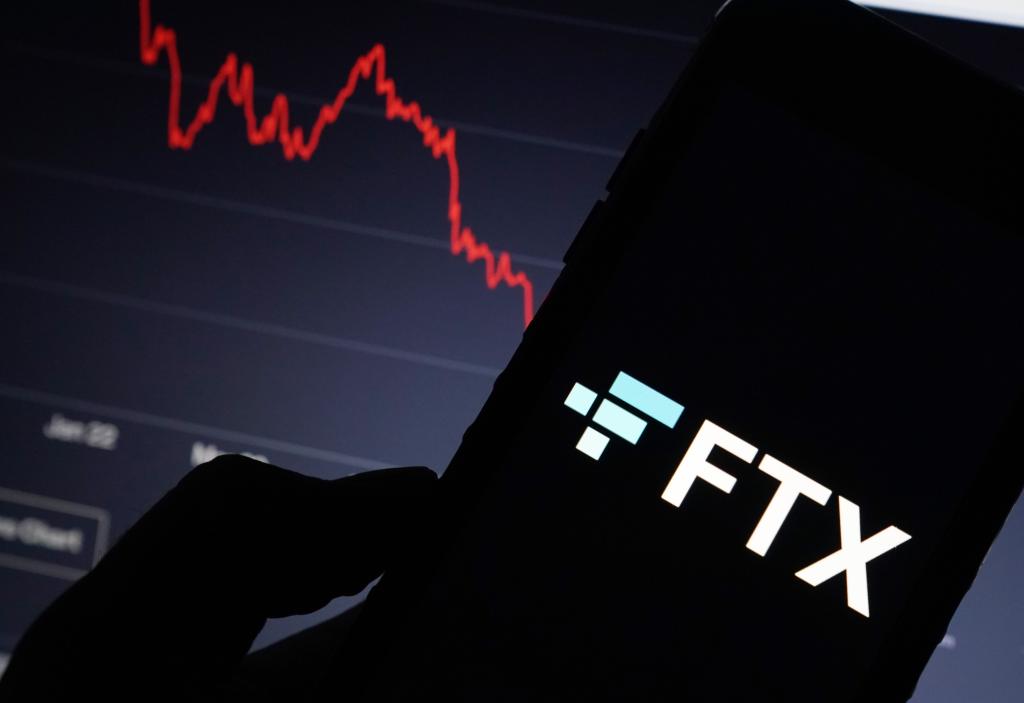 A general view of the FTX website and its logo displayed on a computer screen in New York, NY on November 19, 2022.