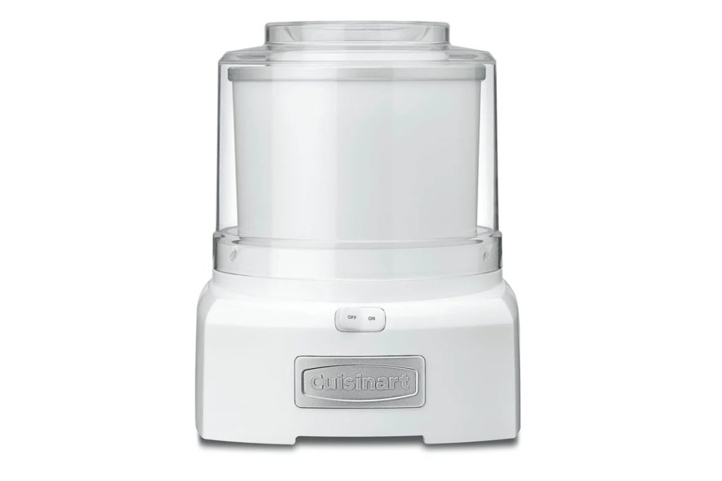 A white food processor with a clear container