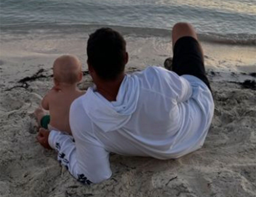 Brooks Koepka is seen on the beach with son Crew.