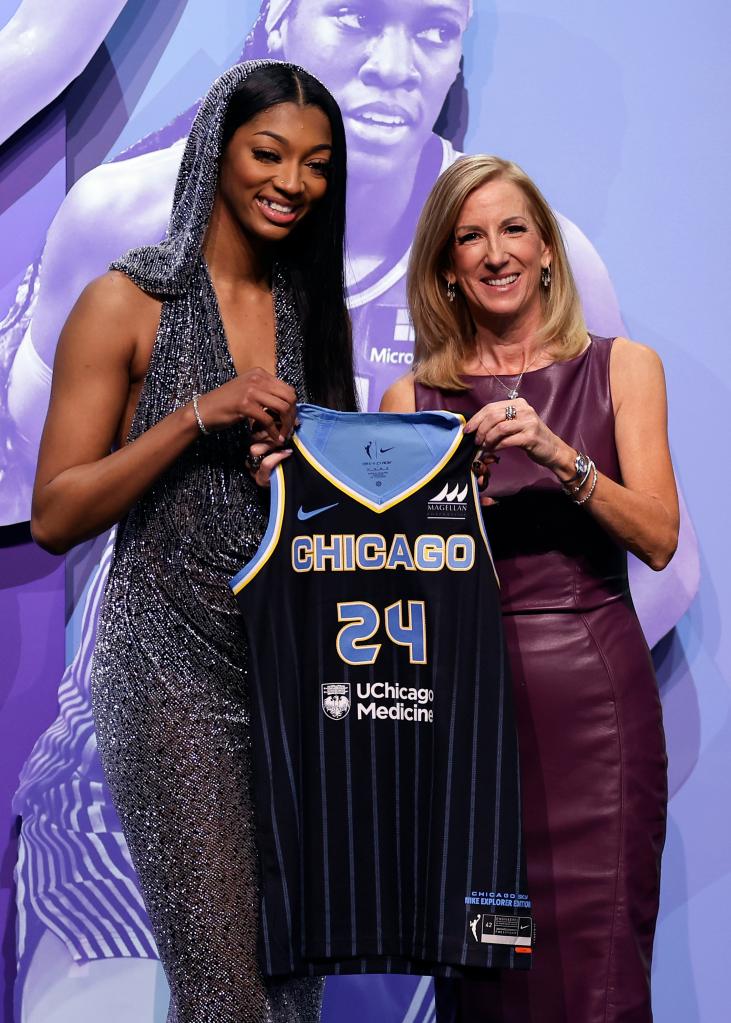 LSU's Angel Reese, left, poses for a photo with WNBA commissioner Cathy Engelbert after being selected seventh overall by the Chicago Sky during the first round of the WNBA basketball draft on Monday, April 15, 2024, in New York. 