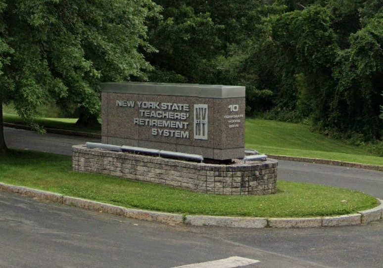 A sign on a stone base for New York State Teacher's Retirement System