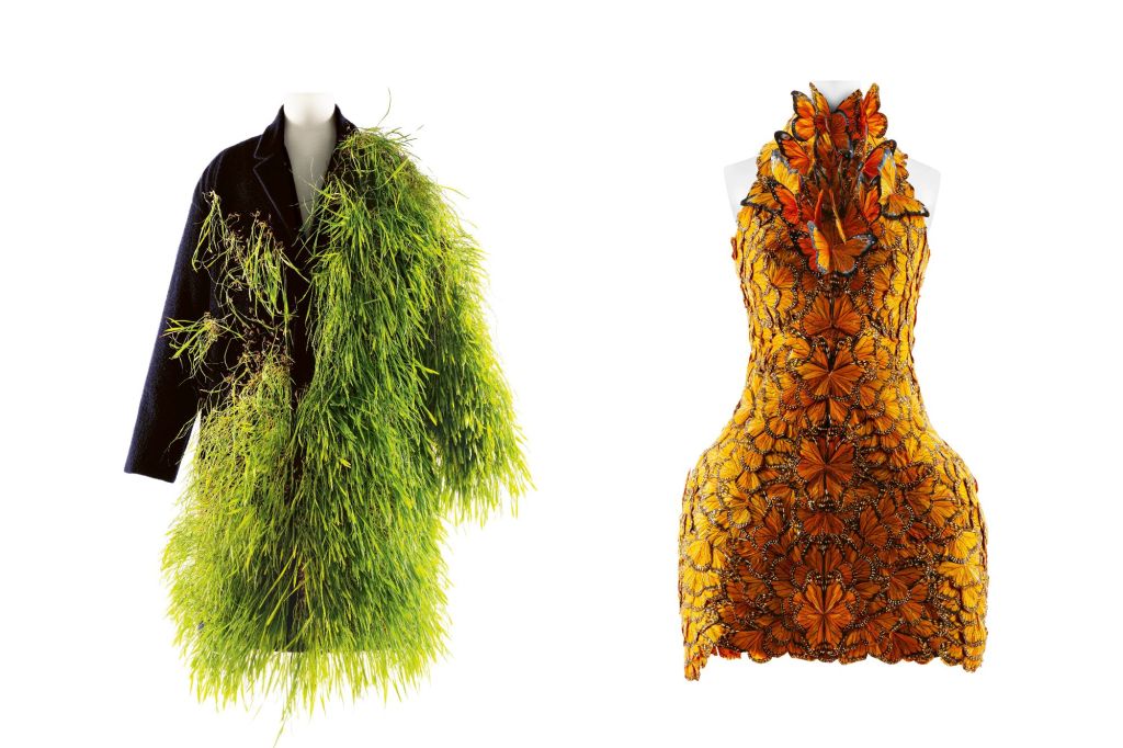 Side-by-side of a grass coat and a butterfly dress, part of the Met's "Sleeping Beauties: Reawakening Fashion" exhibit.