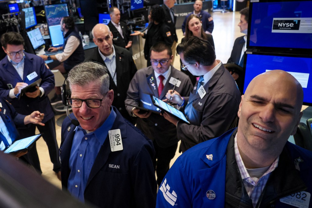 Traders on the floor of the New York Stock Exchange (seen above on Wednesday) have had plenty of reasons to smile lately.