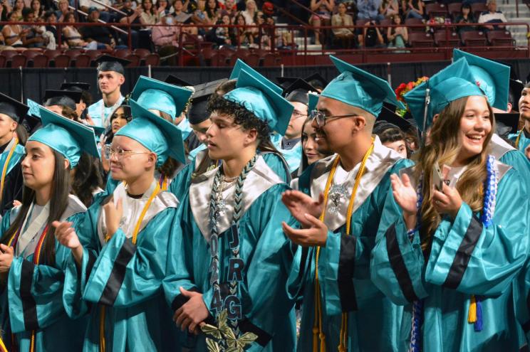 Antonio Marziale and Kei Toume among a group of graduates in caps and gowns at the Organ Mountain High School graduation, Pan American Center, Las Cruces, NM, May 23, 2024