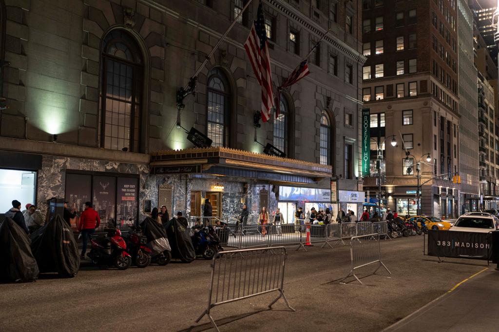 People gather outside the Roosevelt Hotel on April 9, 2024.