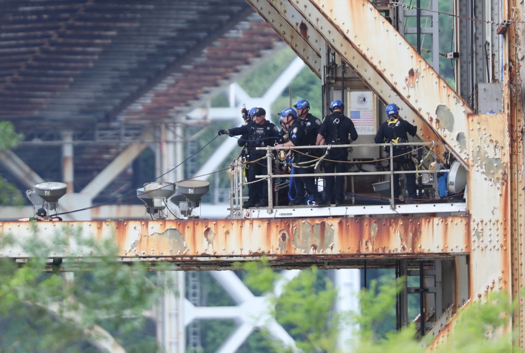 Photo of: The police trying to talk a person down from jumping off the GWB in Manhattan