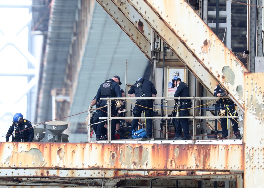 Photo of: The police trying to talk a person down from jumping off the GWB in Manhattan