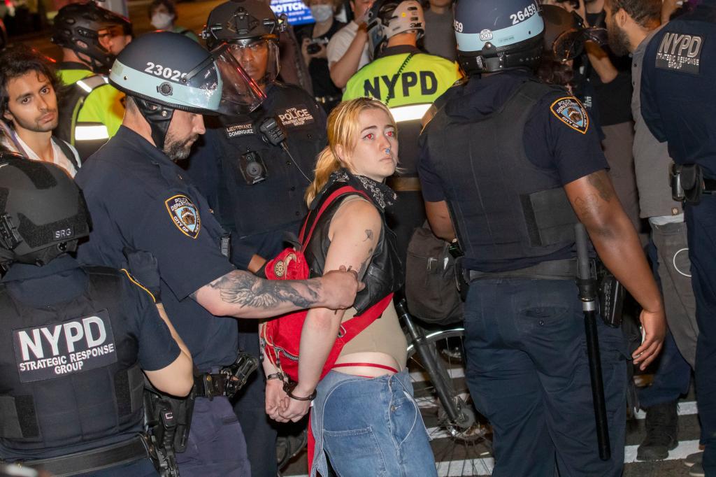 An anti-Israel protester is arrested by the NYPD on Tuesday night.