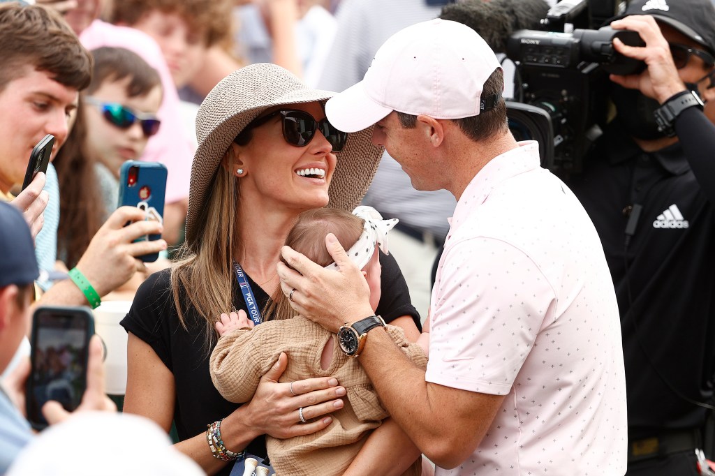 Rory McIlroy and wife Erica with their daughter Poppy in 2021.