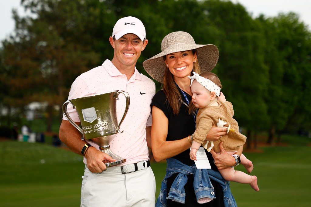 Rory McIlroy celebrates his 2021 Wells Fargo Championship win with wife Erica and daughter Poppy.