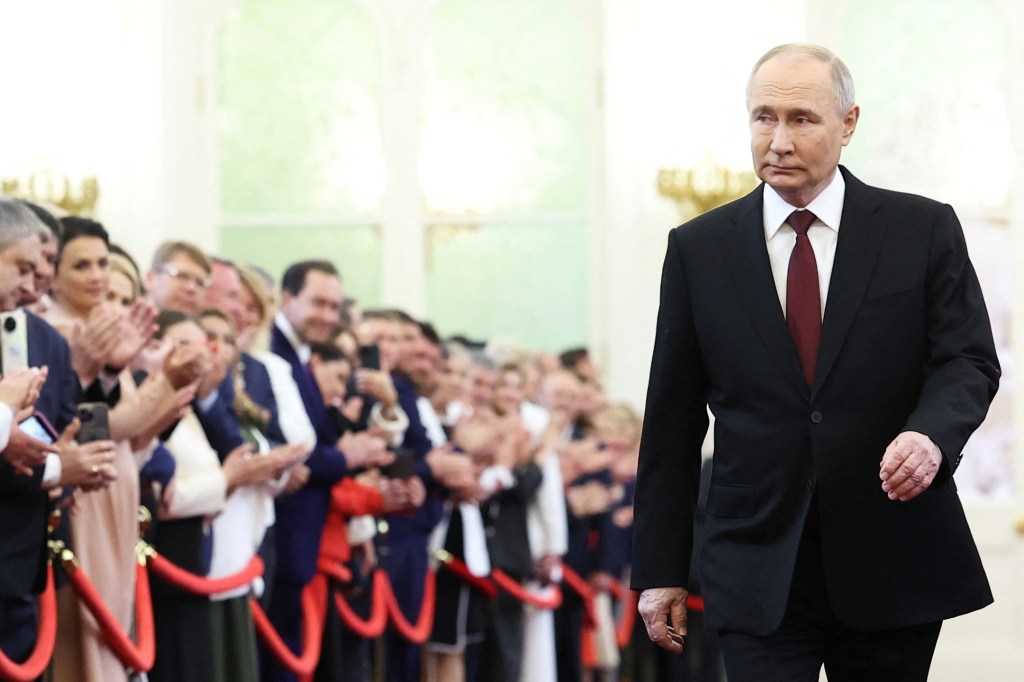 Vladimir Putin walks before his inauguration ceremony at the Kremlin Tuesday.