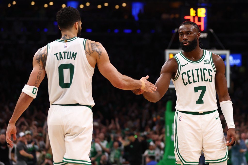 Jaylen Brown #7 of the Boston Celtics celebrates with Jayson Tatum #0 during overtime against the Indiana Pacers in Game One of the Eastern Conference Finals at TD Garden on May 21, 2024 in Boston, Massachusetts. 