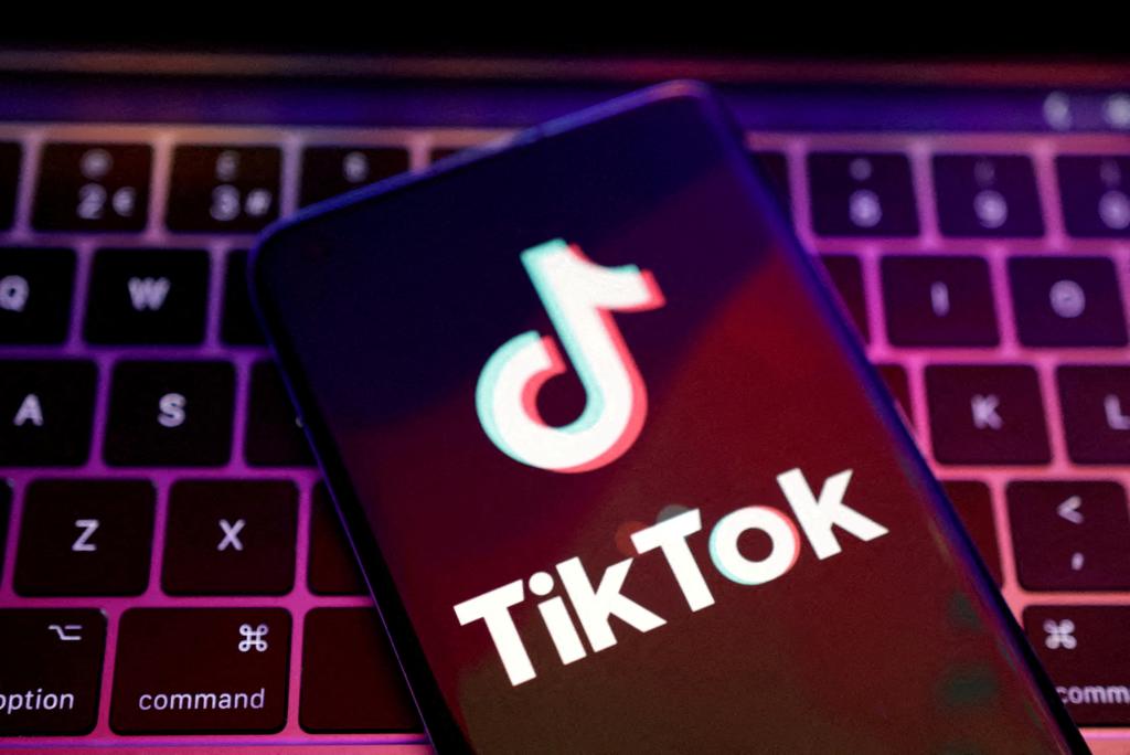 TikTok app logo illustration displayed on a cellphone placed on a keyboard, taken on August 22, 2022.