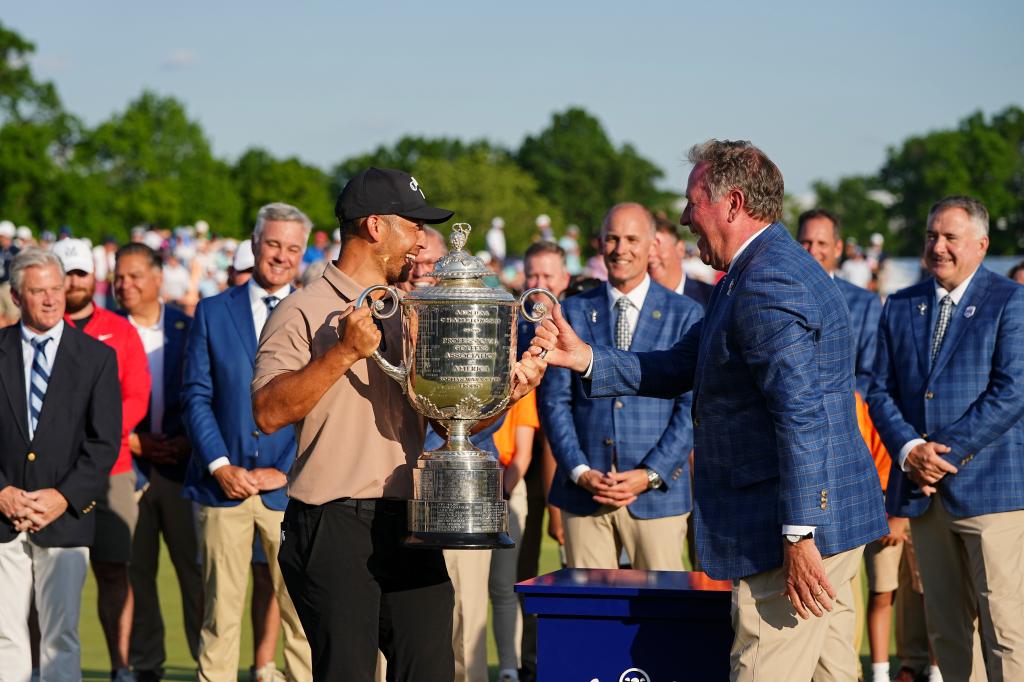 Xander Schauffele is presented The Wanamaker Trophy after winning the PGA Championship golf tournament at Valhalla Golf Club. 