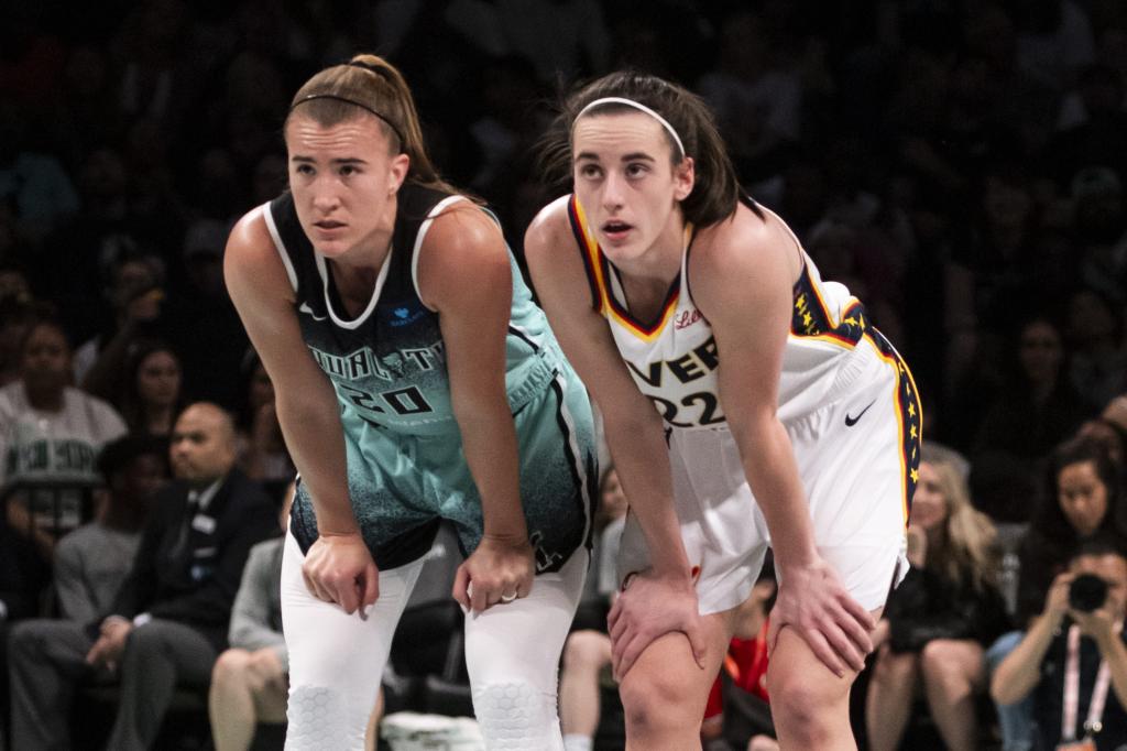 Sabrina Ionescu #20 of the New York Liberty and Caitlin Clark at Barclays Center on Sunday night.