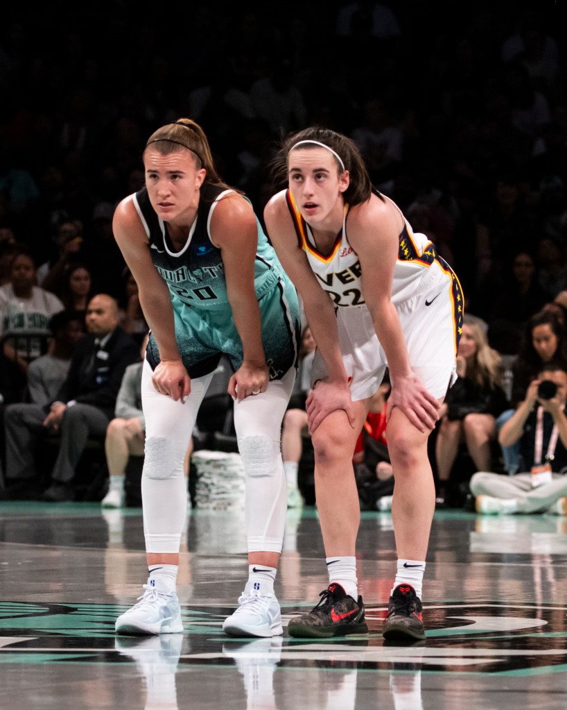 Sabrina Ionescu #20 of the New York Liberty and Caitlin Clark at Barclays Center on Sunday night.